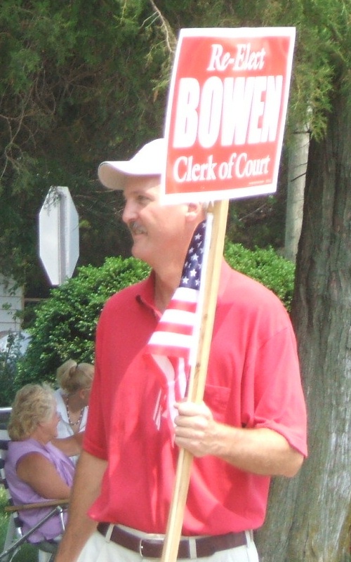 Clerk of Courts Mark Bowen with his large sign.